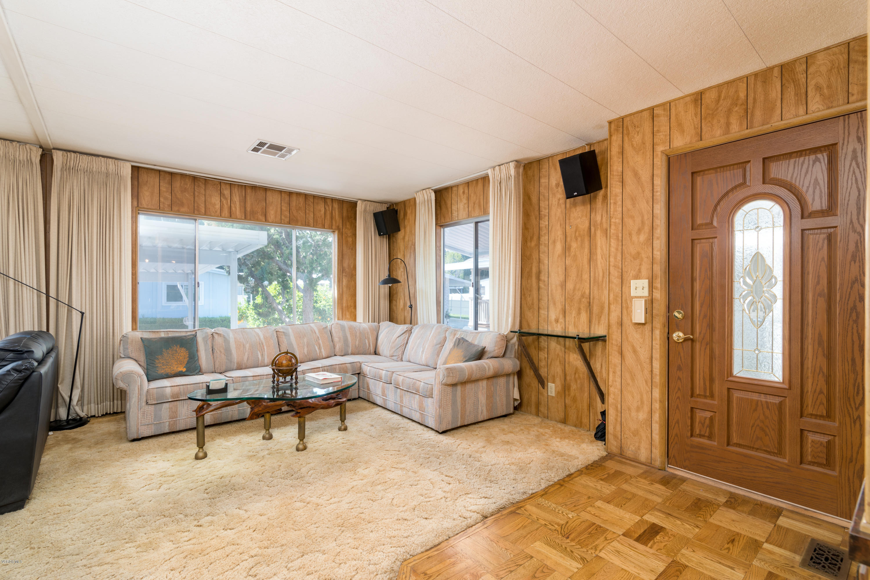 6480 Katherine Street, Unit 16 Simi Valley, CA 93063 - Photo 6 of 24 a living room with furniture and a large window