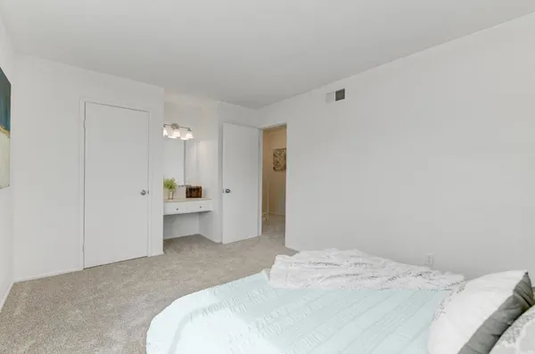 a bedroom with a white bed
