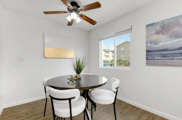 a dining room with furniture and window