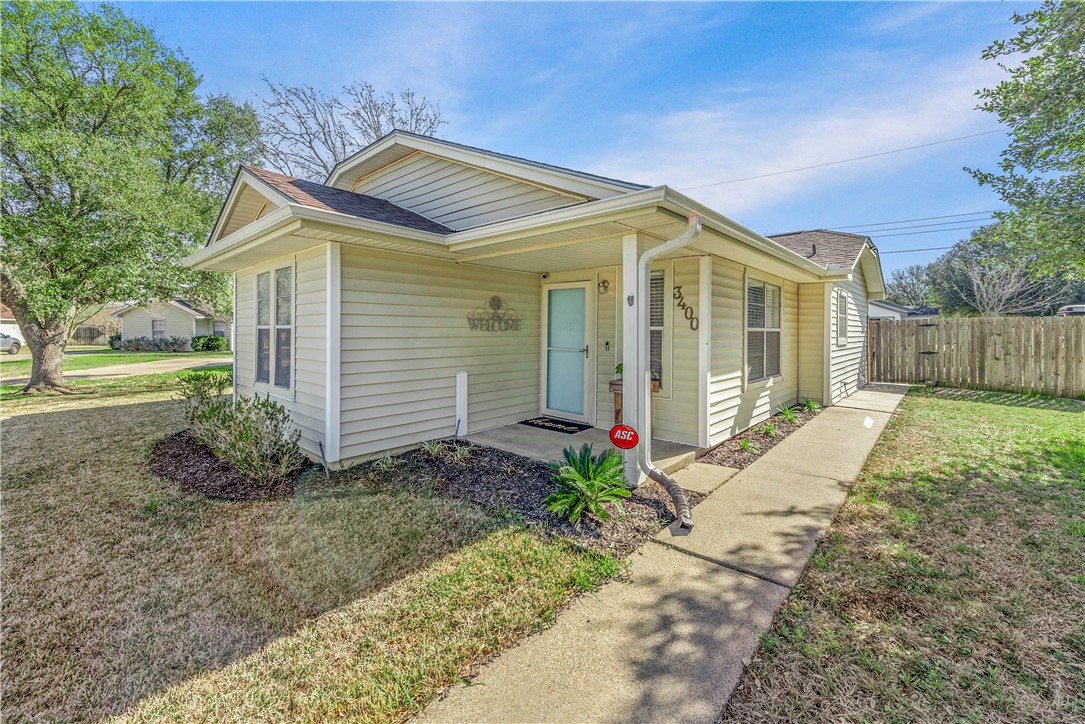 3400 Timberline Court Bryan, TX 77803 - Photo 1 of 1 View of front facade featuring a shingled roof, a