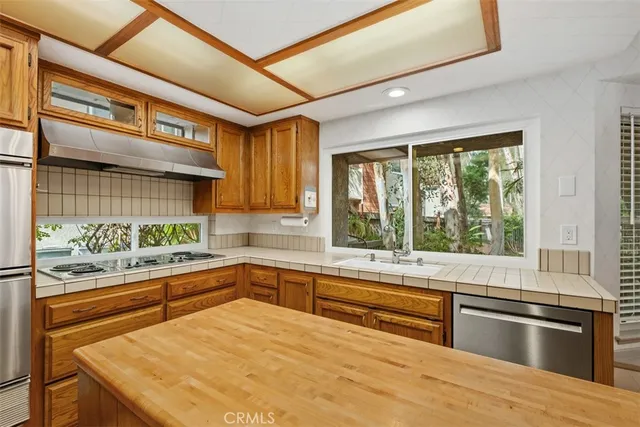 a kitchen with granite countertop cabinets and oven