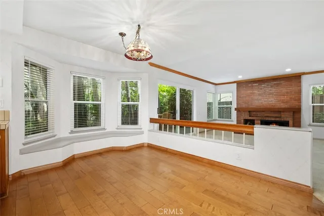 an empty room with furniture and a fireplace