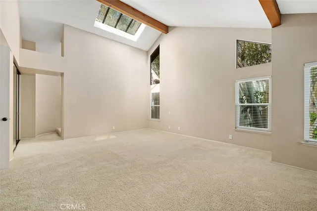 a spacious bathroom with a double vanity sink and a mirror