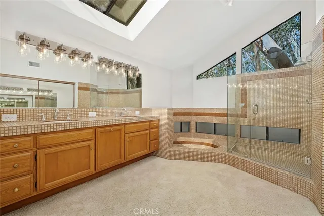 a bathroom with a bathtub and shower