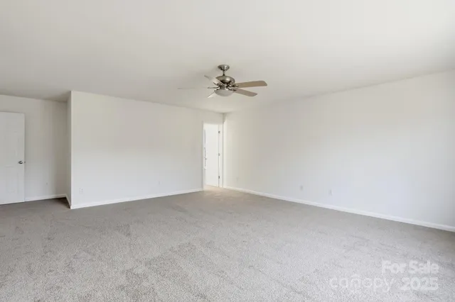 a view of a big room with carpet