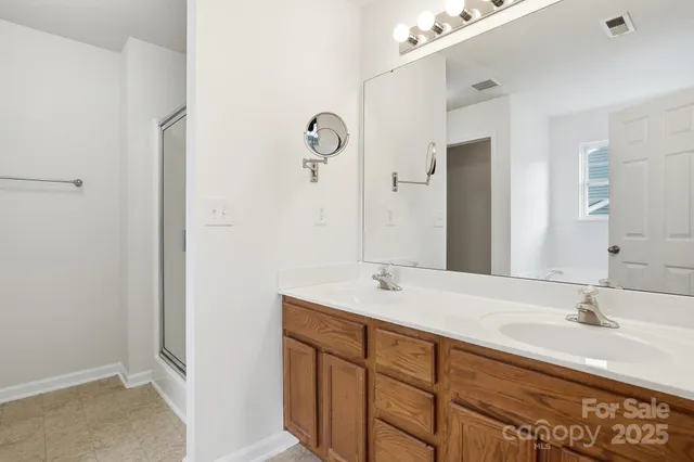 a white bath tub sitting next to a toilet