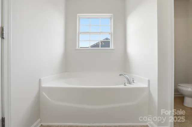 a bathroom with a shower and a sink