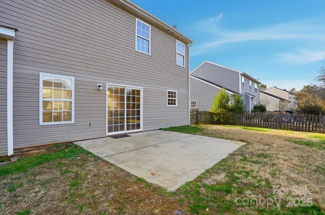 a view of a swimming pool with a yard