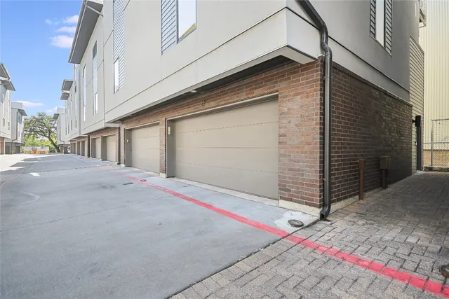 a front view of a house with garage