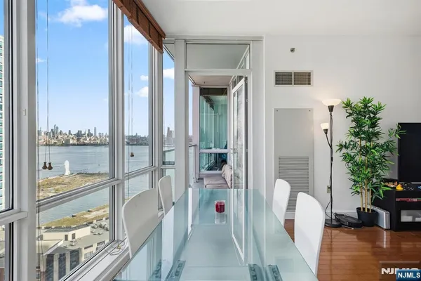 a balcony view with a potted plant on the table