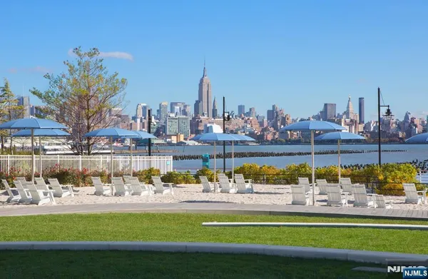 a view of swimming pool with outdoor seating