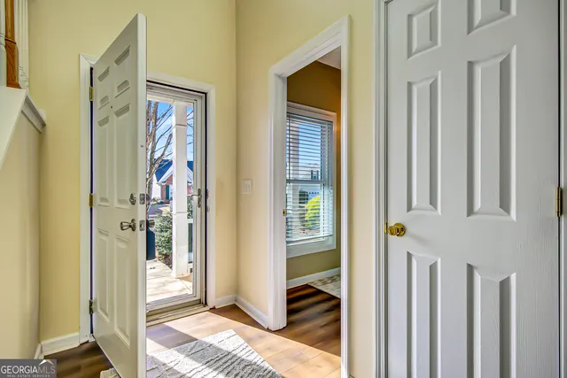 a view of bedroom with a bed and wooden floor