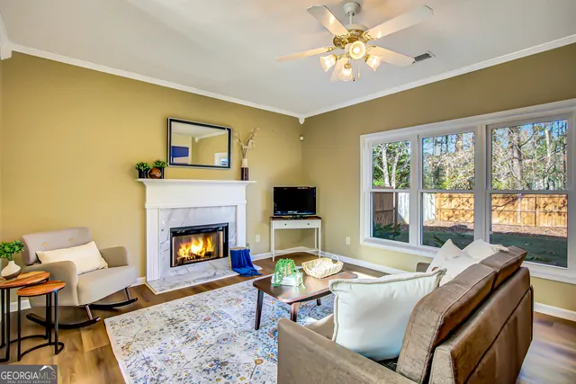 a living room with furniture and a fireplace