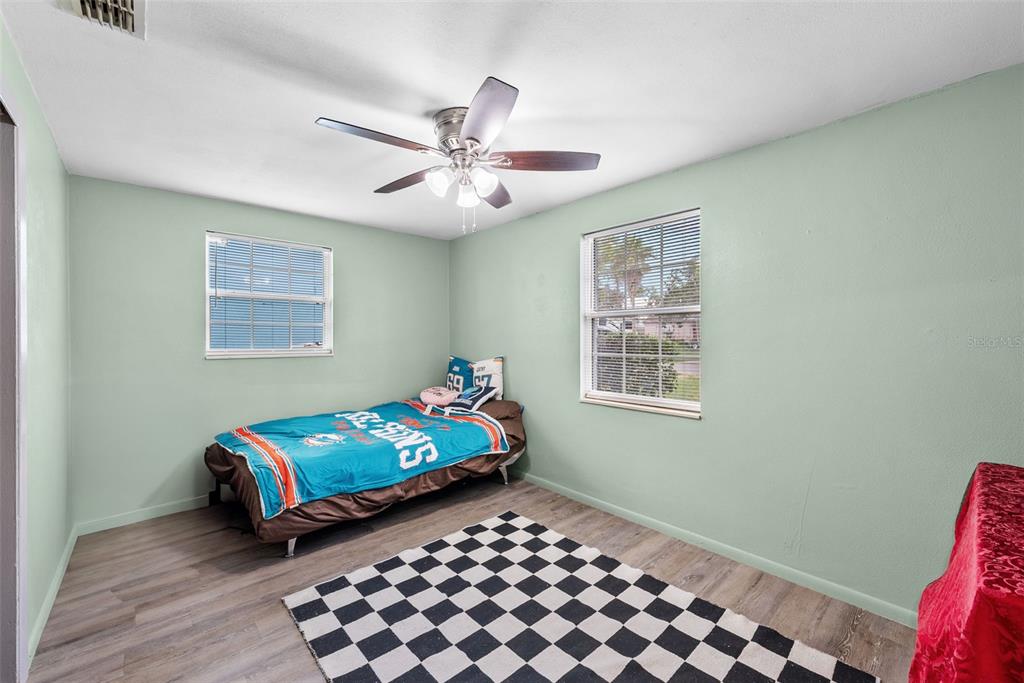 4245 Crestfield Avenue Holiday, FL 34691 - Photo 17 of 28 a bedroom with a bed and a window