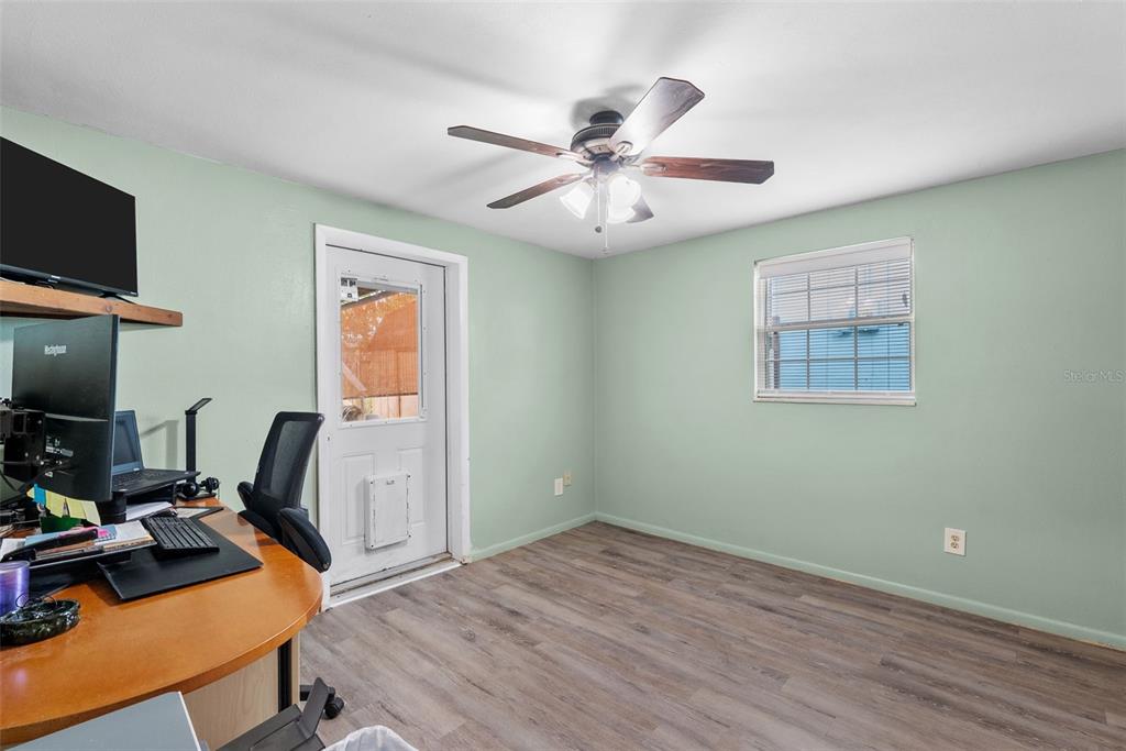 4245 Crestfield Avenue Holiday, FL 34691 - Photo 20 of 28 a view of a workspace with furniture and a window