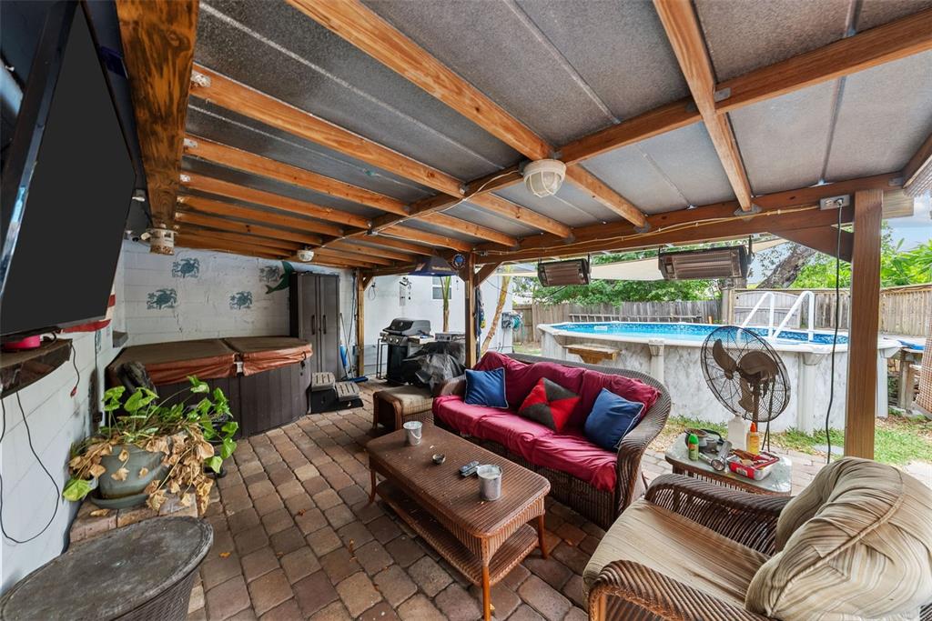 4245 Crestfield Avenue Holiday, FL 34691 - Photo 22 of 28 a outdoor living space with furniture and garden view