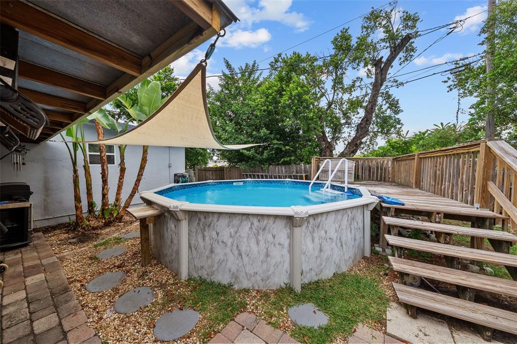 4245 Crestfield Avenue Holiday, FL 34691 - Photo 24 of 28 a view of a backyard with a tub