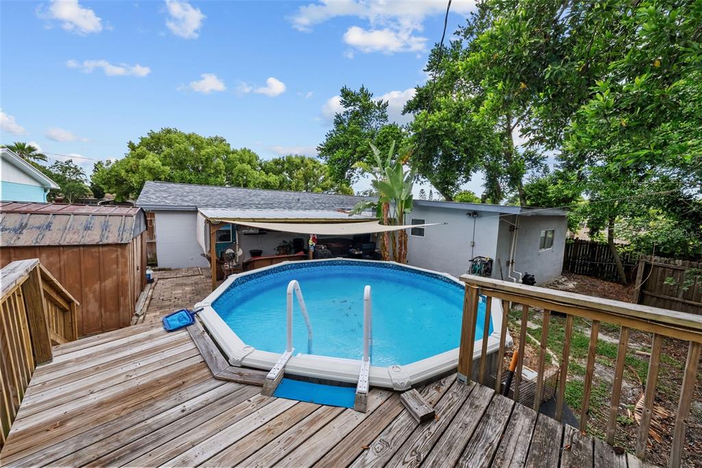 4245 Crestfield Avenue Holiday, FL 34691 - Photo 25 of 28 a view of a roof deck with wooden floor and fence