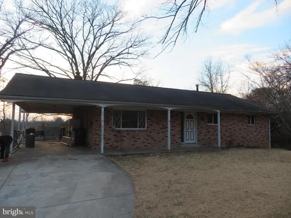 a view of house with yard
