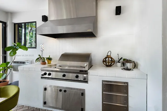 a white stove top oven sitting inside of a kitchen