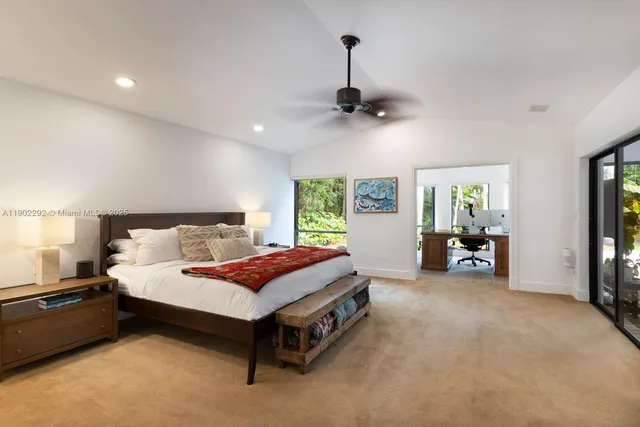 a bed room with a bed and a tv