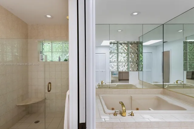 a bathroom with a tub and sink