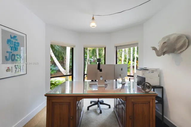 a dining room with table and chairs