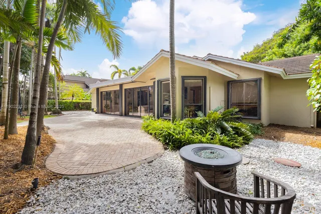 a view of a chair and table in the patio