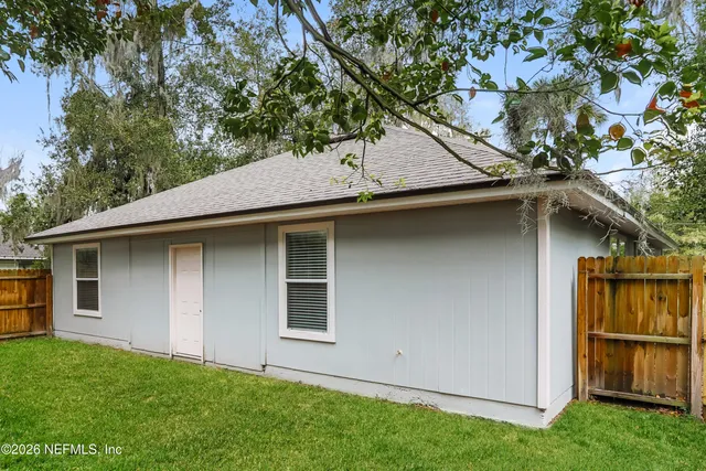 a backyard of a house with lots of green space