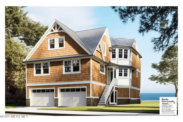 a view of a white house with large windows and a yard