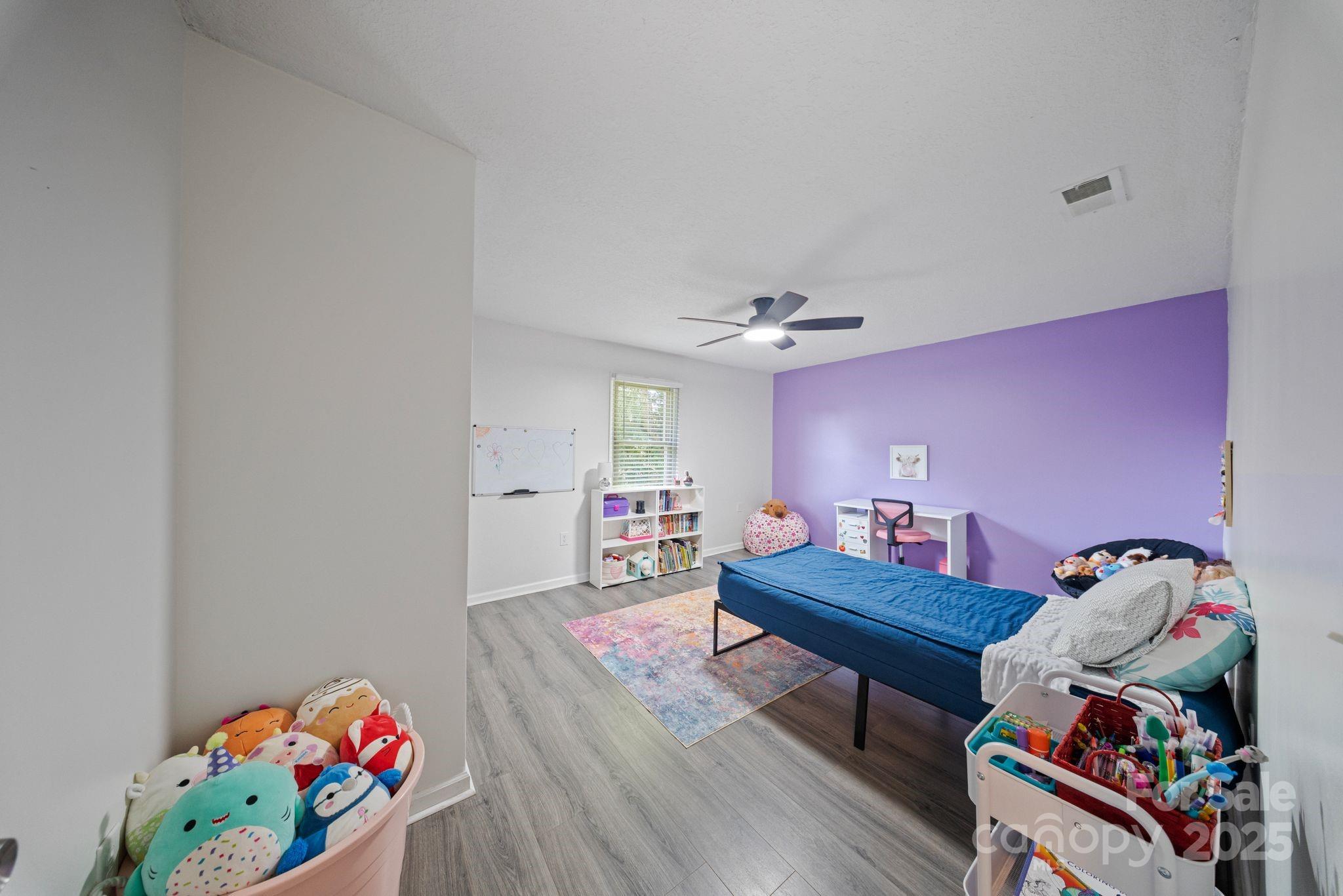 5703 Valley Field Road Southeast Hickory, NC 28602 - Photo 23 of 33 a living room with furniture and a wooden floor