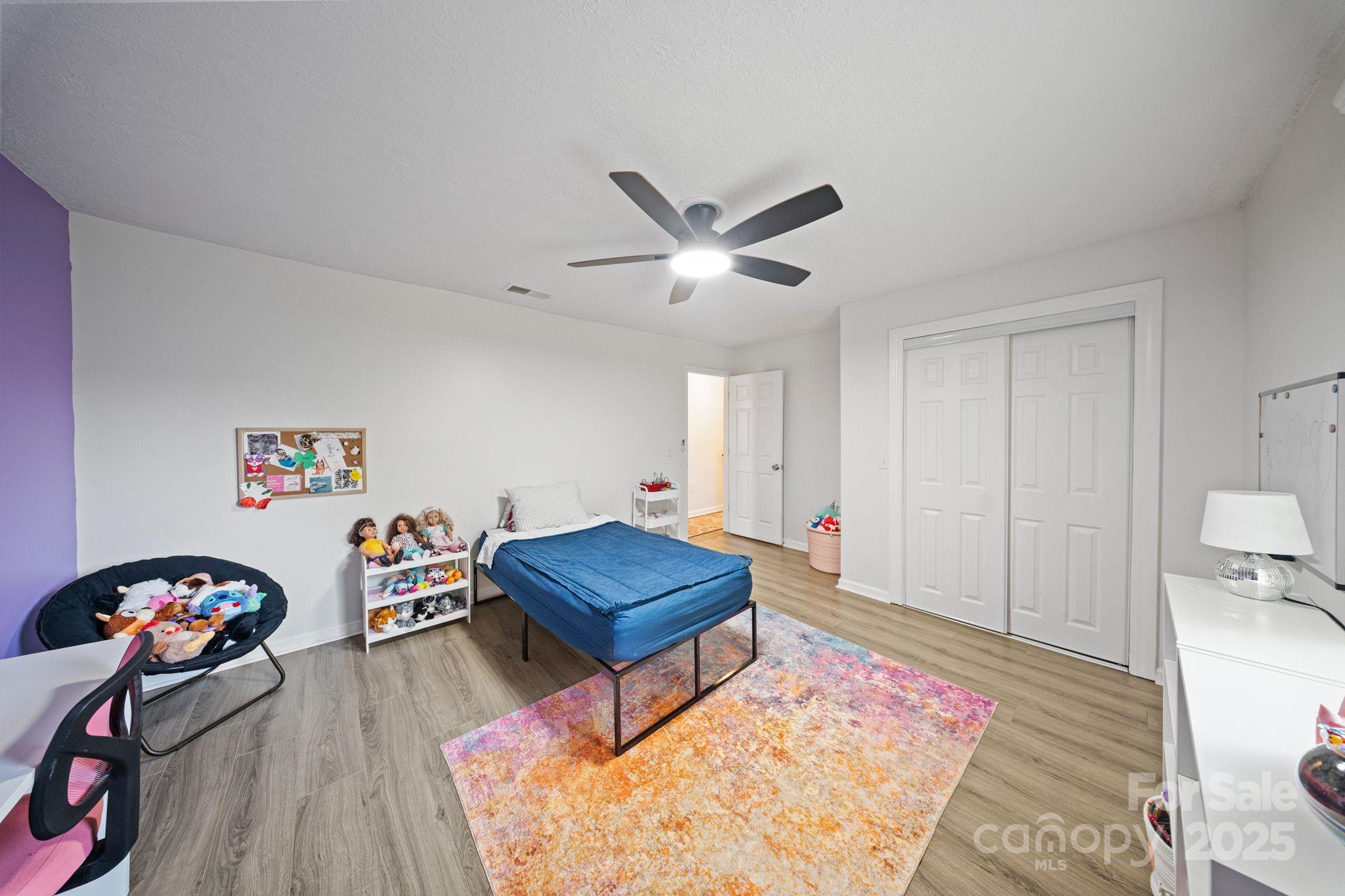 5703 Valley Field Road Southeast Hickory, NC 28602 - Photo 24 of 33 a living room with furniture a rug and a wooden floor