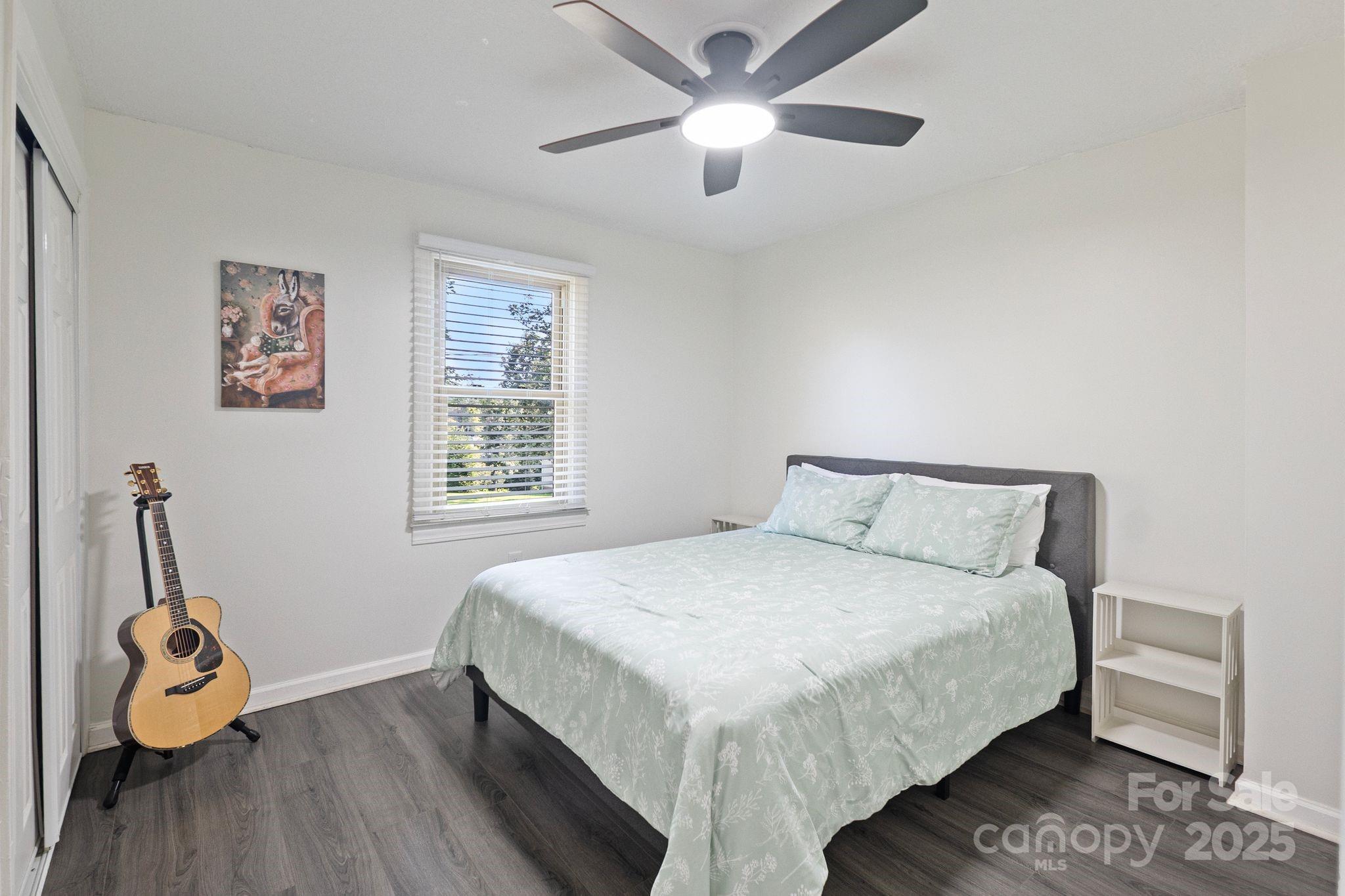 5703 Valley Field Road Southeast Hickory, NC 28602 - Photo 27 of 33 a bedroom with a bed and a chandelier