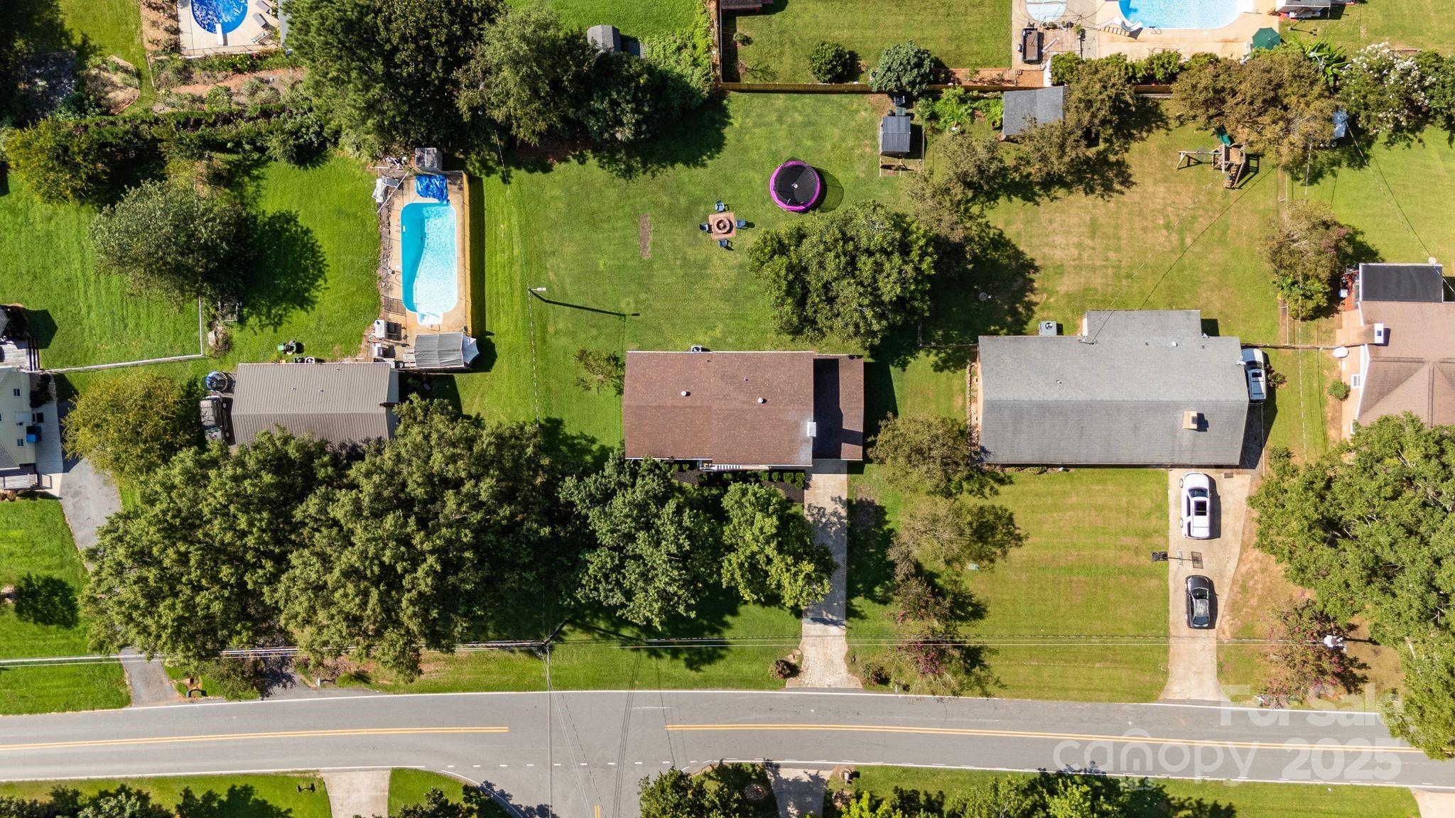5703 Valley Field Road Southeast Hickory, NC 28602 - Photo 32 of 33 an aerial view of a house with a yard basket ball court and outdoor seating