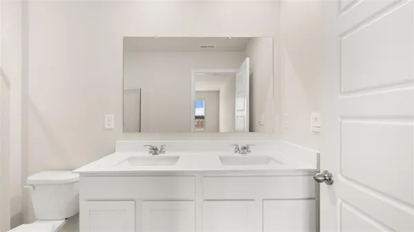 a bathroom with a sink and a toilet