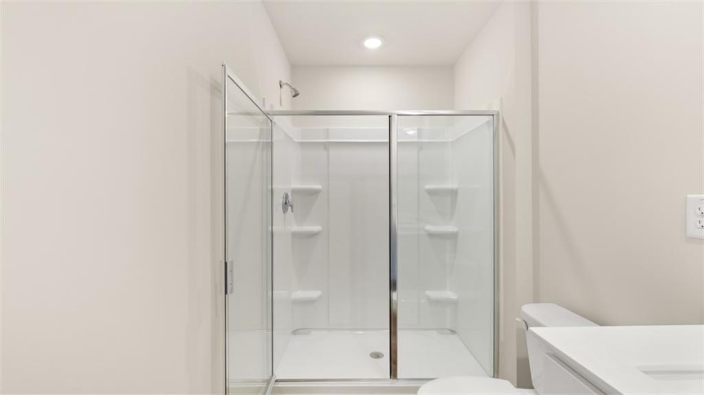 121 Kenmore Circle Perry, GA 31069 - Photo 20 of 28 a bathroom with a shower and a glass door