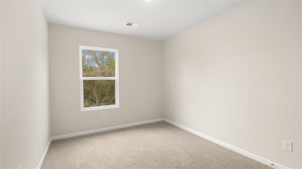 121 Kenmore Circle Perry, GA 31069 - Photo 23 of 28 an empty room with a window