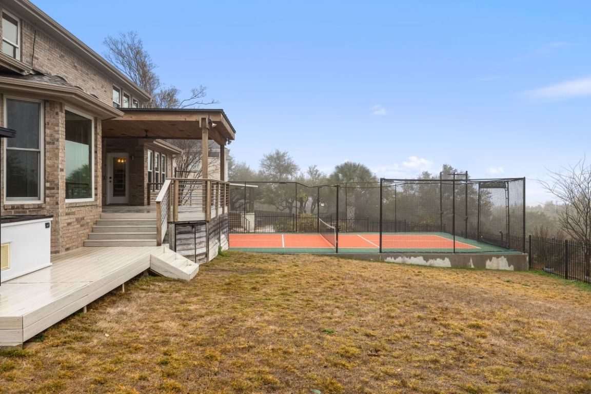 2137 Rivina Drive Austin, TX 78733 - Photo 37 of 39 View of yard featuring a wooden deck