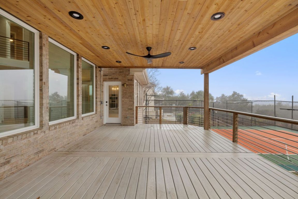 2137 Rivina Drive Austin, TX 78733 - Photo 39 of 39 Wooden terrace featuring a ceiling fan