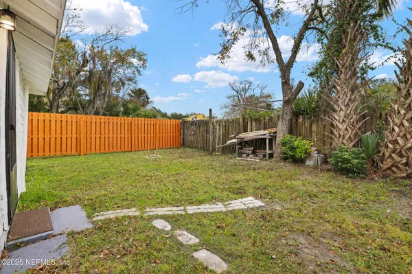 a backyard of a house with lots of green space
