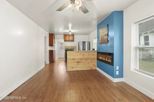 a view of a livingroom with wooden floor