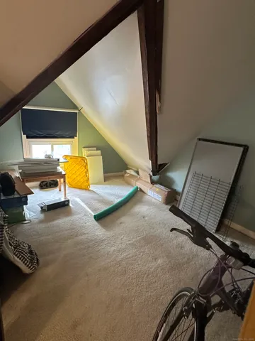 a view of gym equipment and floor to ceiling window