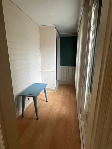 a view of wooden floor and chair in a room