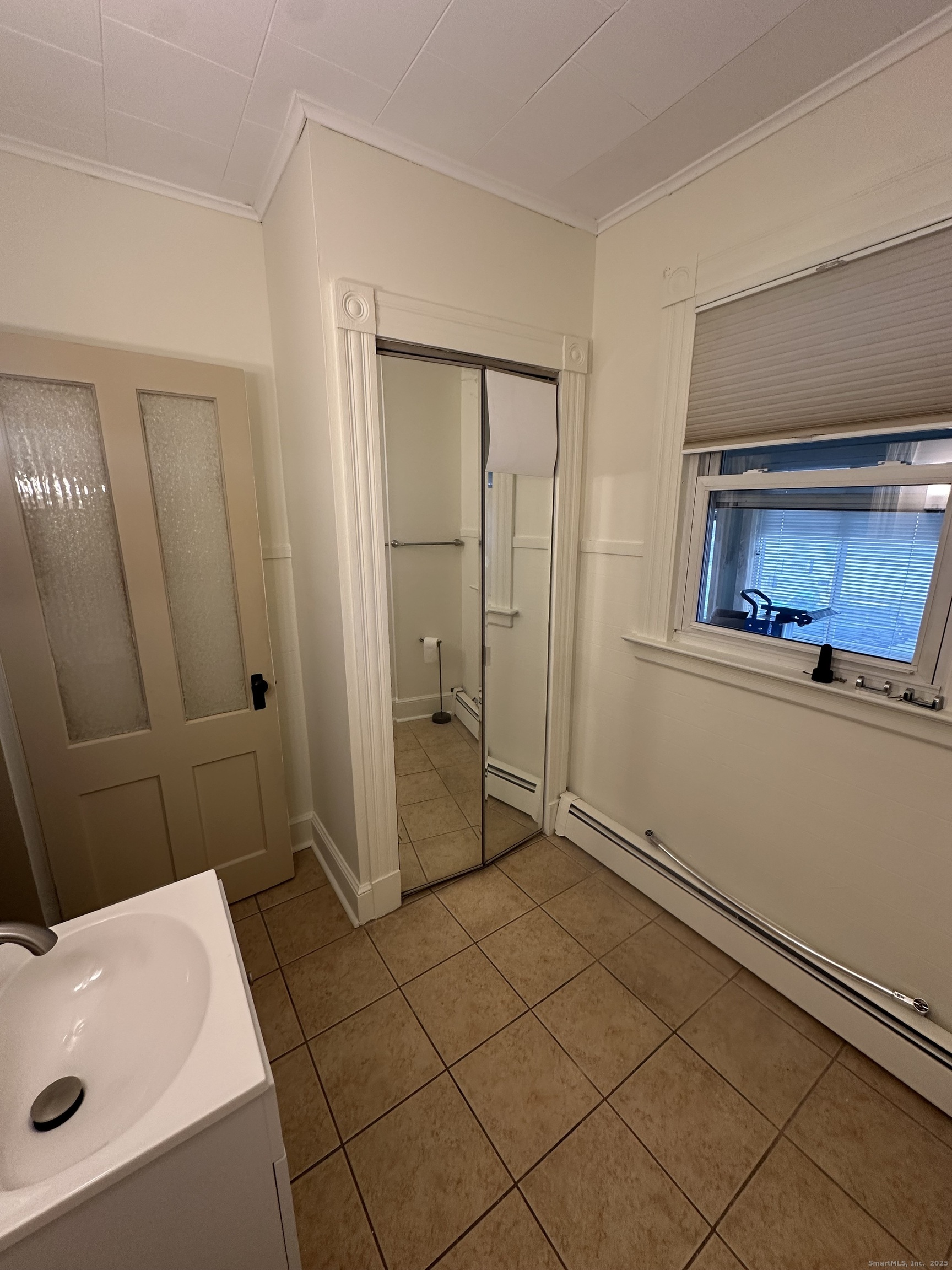 421 Main Street Wallingford, CT 06492 - Photo 19 of 27 a bathroom with a sink and a mirror