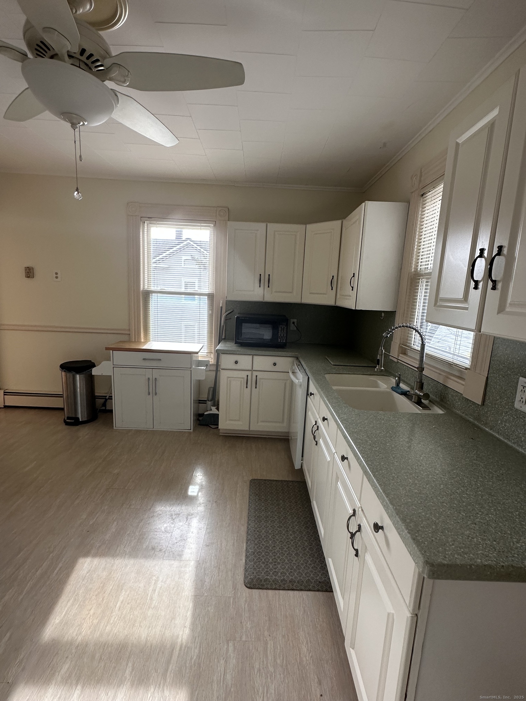 421 Main Street Wallingford, CT 06492 - Photo 21 of 27 a large kitchen with cabinets