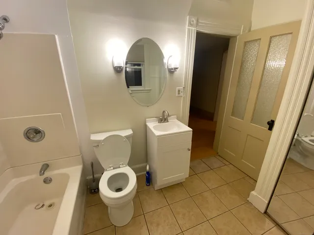 a bathroom with a toilet and a sink
