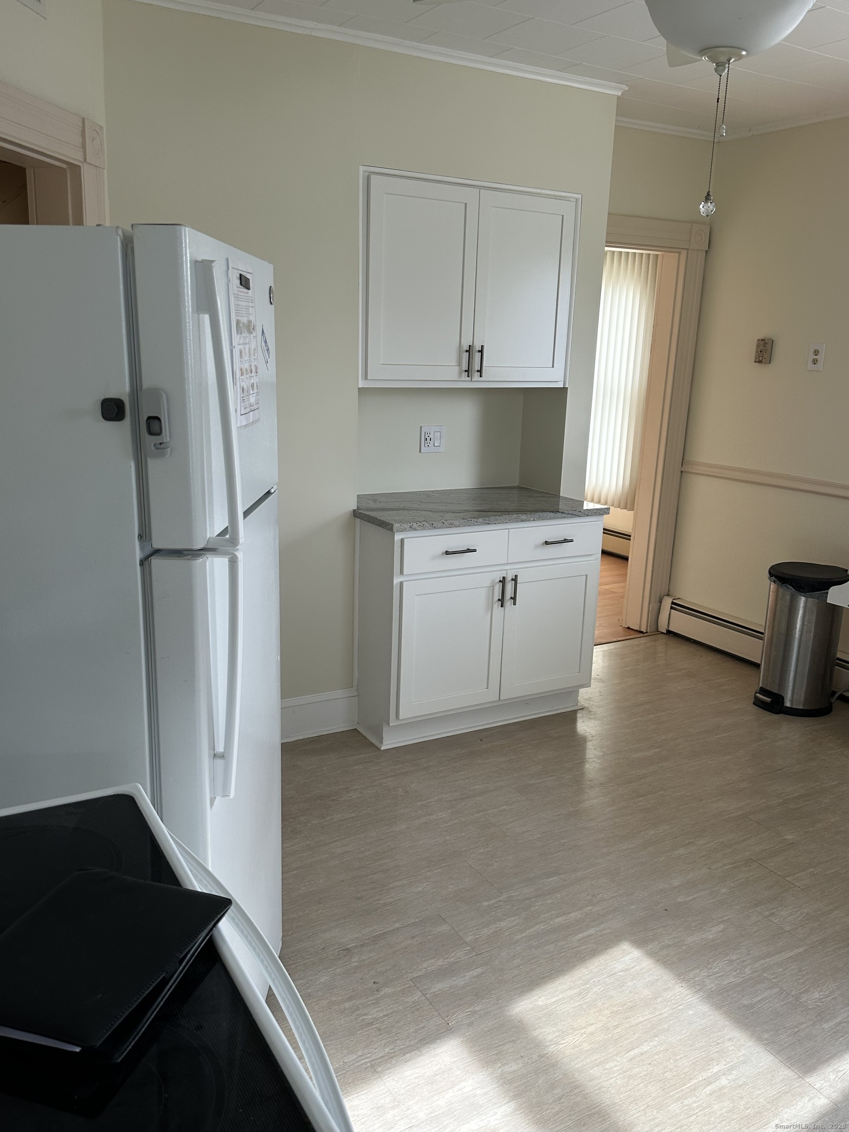 421 Main Street Wallingford, CT 06492 - Photo 25 of 27 a kitchen with a refrigerator and a sink