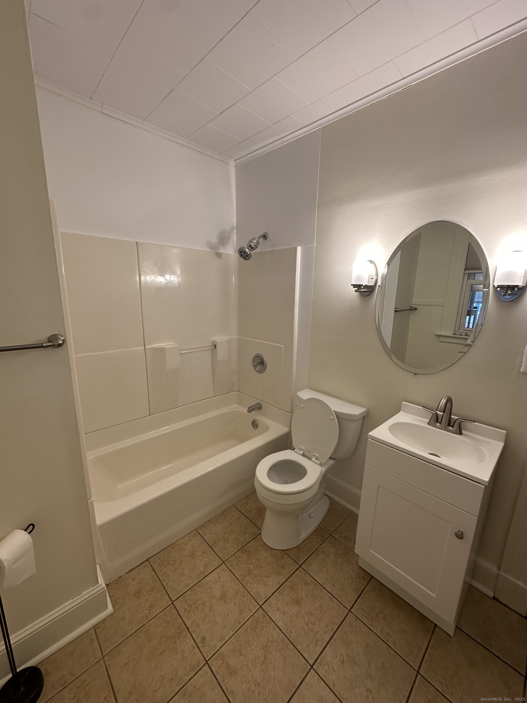 421 Main Street Wallingford, CT 06492 - Photo 26 of 27 a bathroom with a sink a toilet and shower