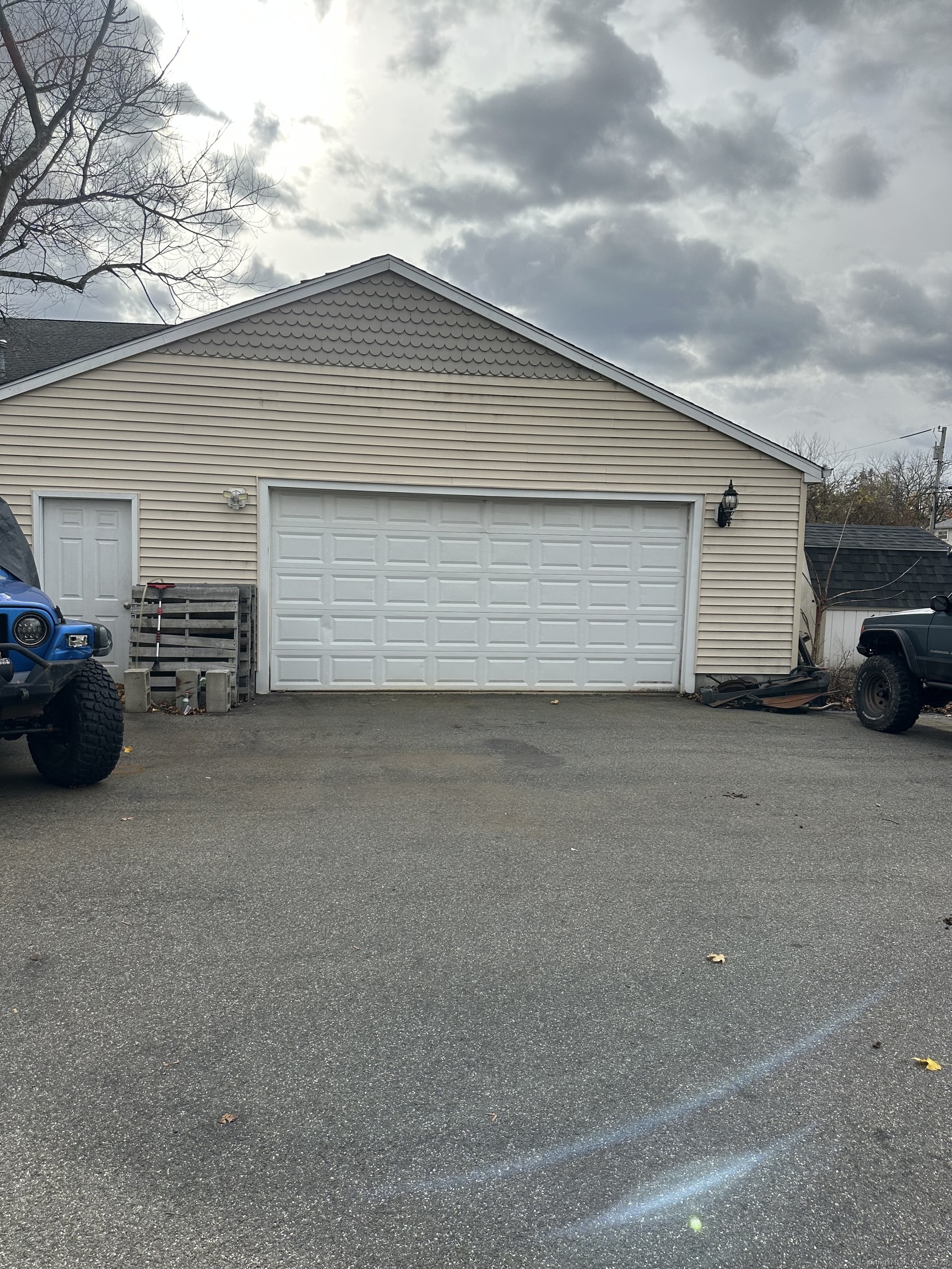 421 Main Street Wallingford, CT 06492 - Photo 27 of 27 a house view with a car parked in front of it