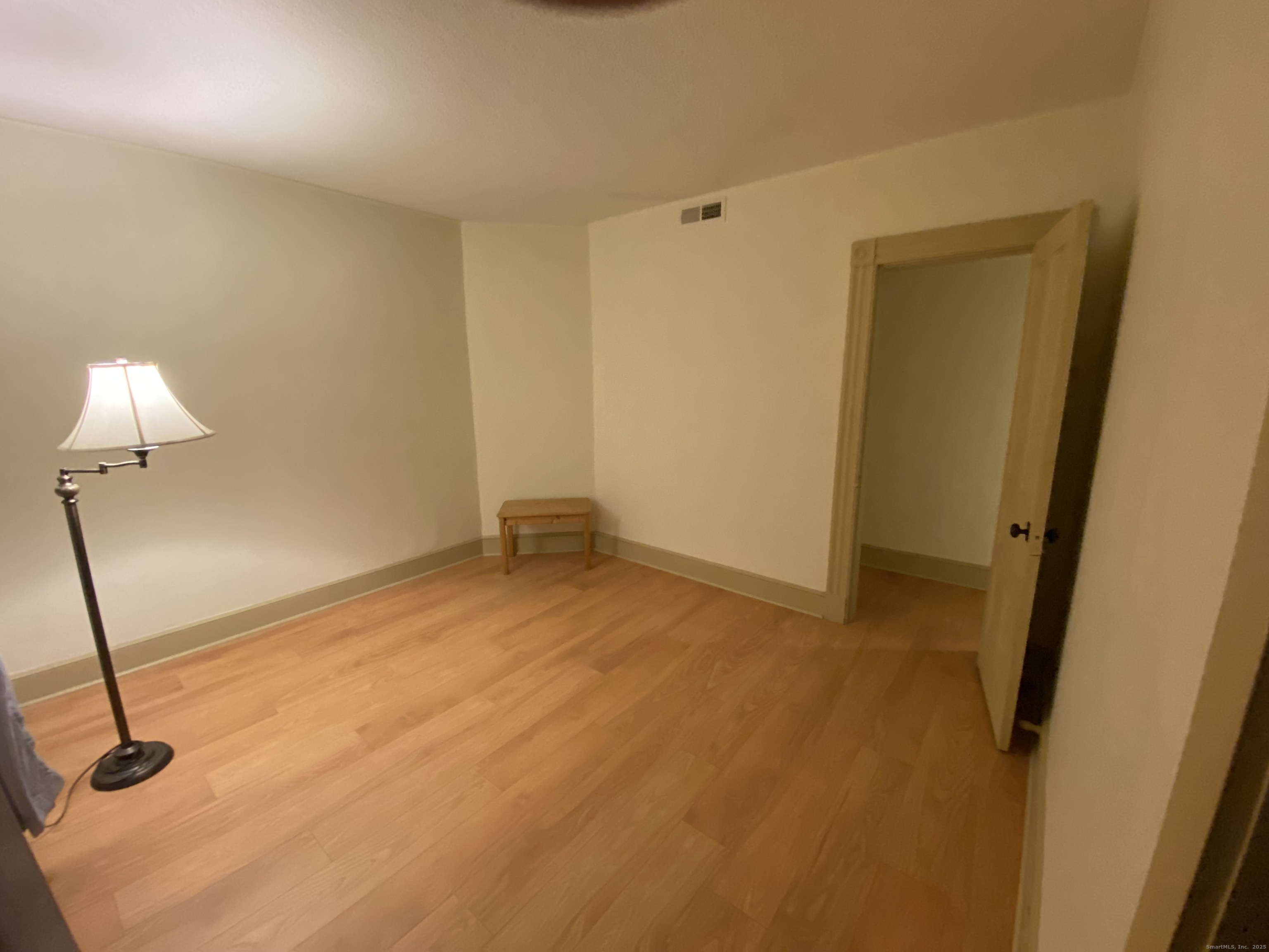 421 Main Street Wallingford, CT 06492 - Photo 9 of 27 a view of a room with a wooden floor and a sink